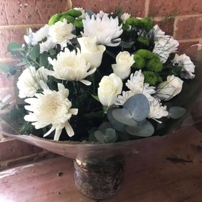 Always Classy - A stunning handtied in water presented in a gif bag/box. Created using all white flowers with complimentary foliage. Hand delivered with care in and around Perth by Carramar Flowers & Gifts.